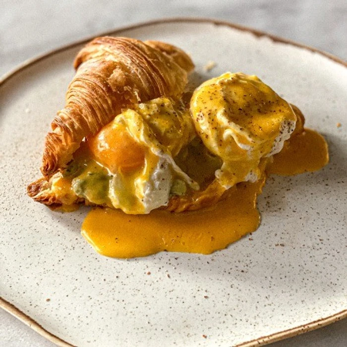 Croissant With Poached Eggs & Avocado