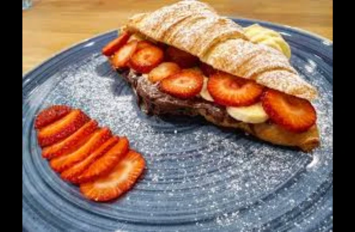 Milk chocolate, banana, strawberry, and hazelnut croissant